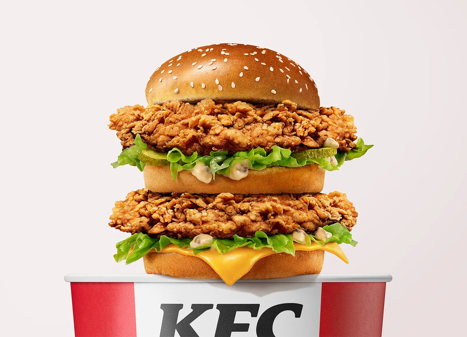 CGI and ditgital imaging of fried chicken sandwich and bucket for KFC. Creative problem-solving through high-end digital imaging by Pierre Bourjo.